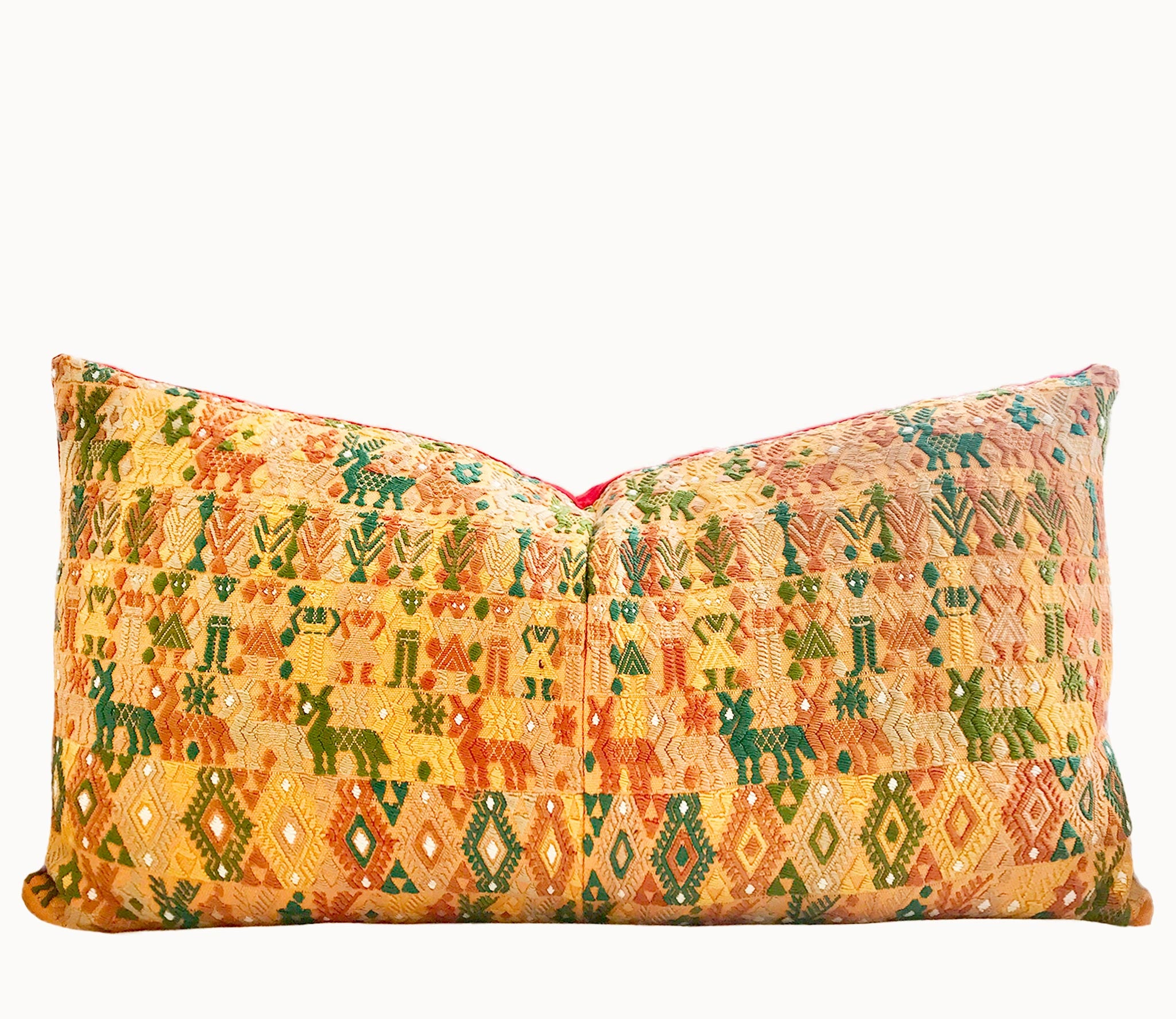 Embroidered textile cushions made from a Guatemalan huipil and corte.