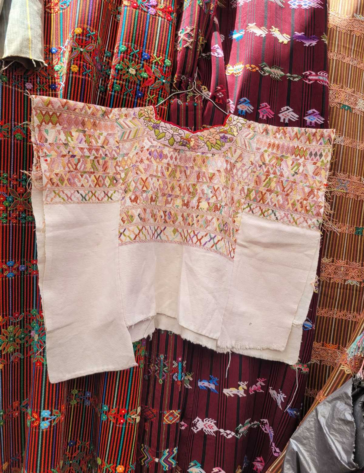 Pale on white San Juan Cotzal huipil #3-10