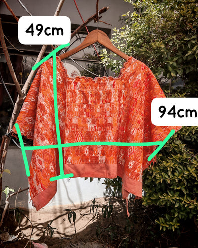 Orange Coban huipil for April
