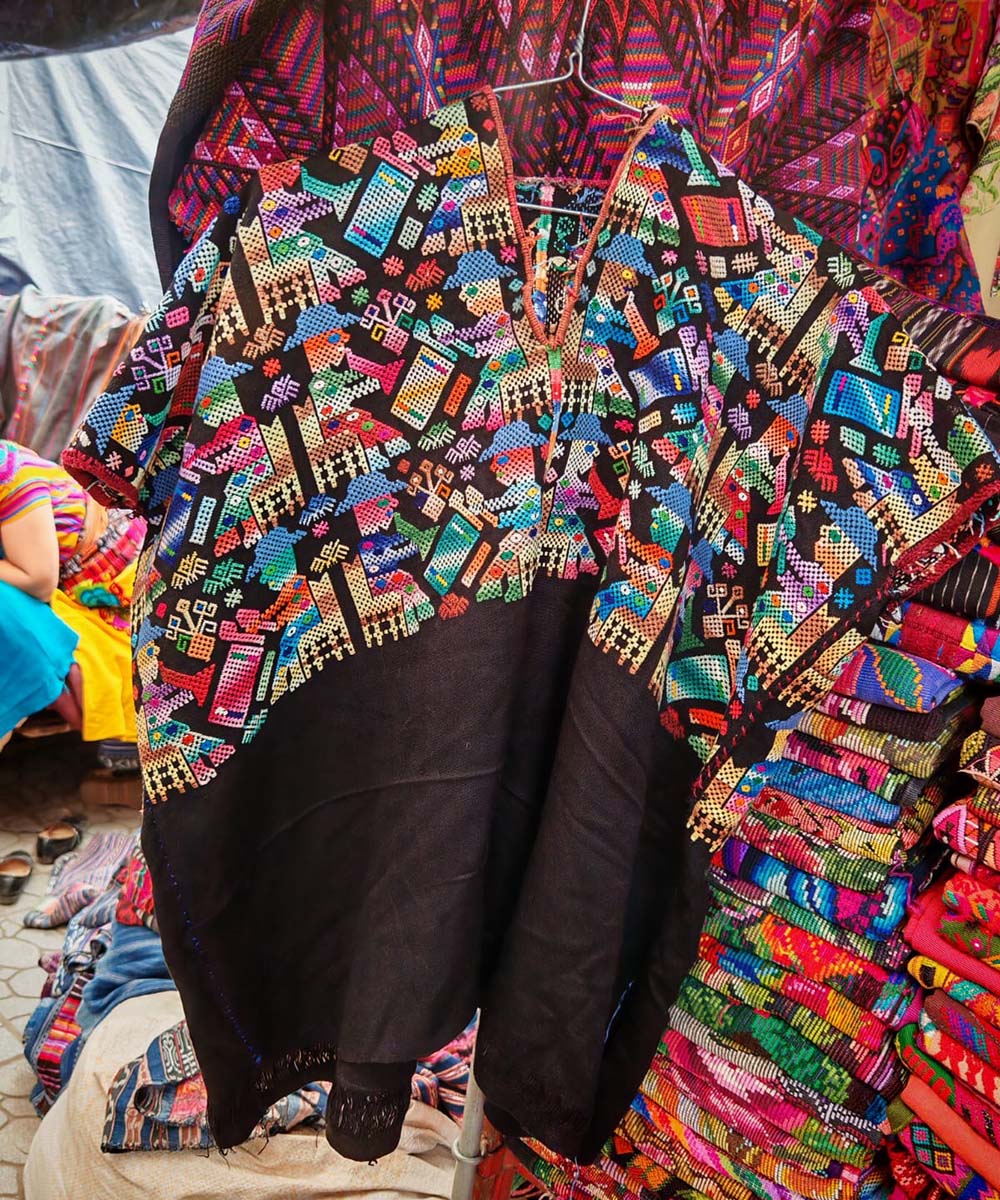 Colorful on black Nahuala huipil