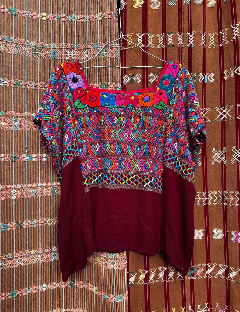 Colourful on burgundy San Juan Cotzal huipil #5-157