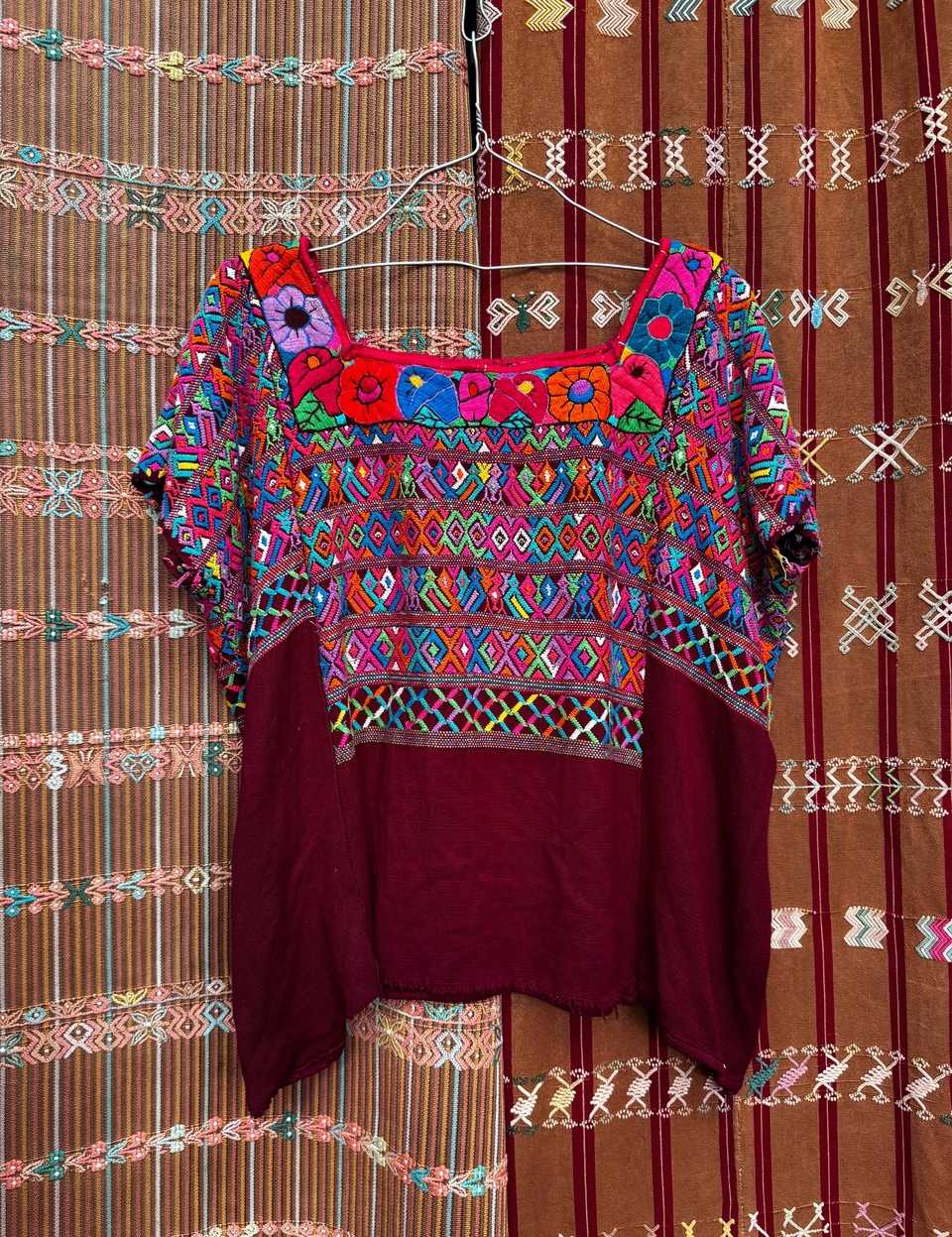 Colourful on burgundy San Juan Cotzal huipil #5-157