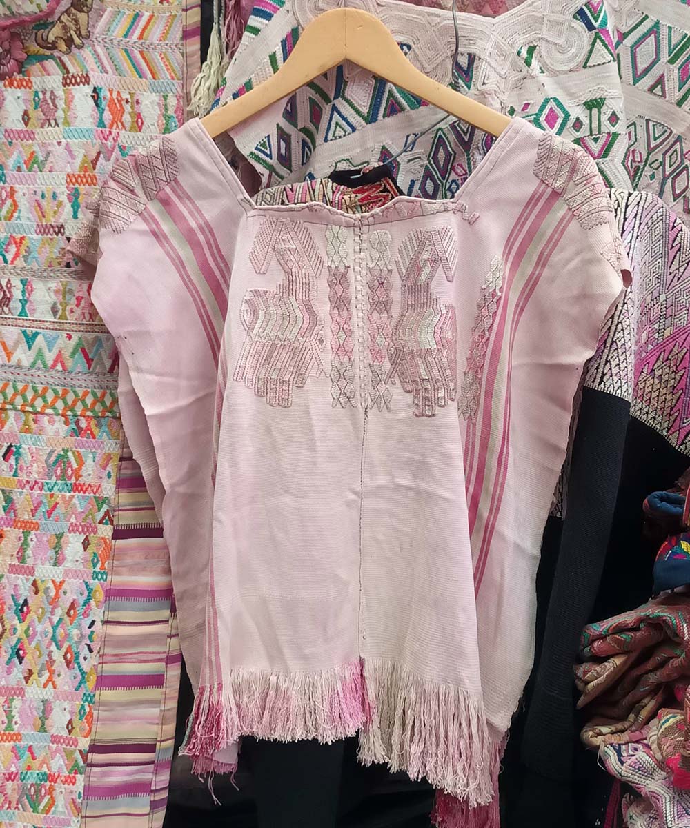 Pale pink Chajul huipil with fringe