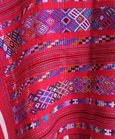 Red huipil with purple accents