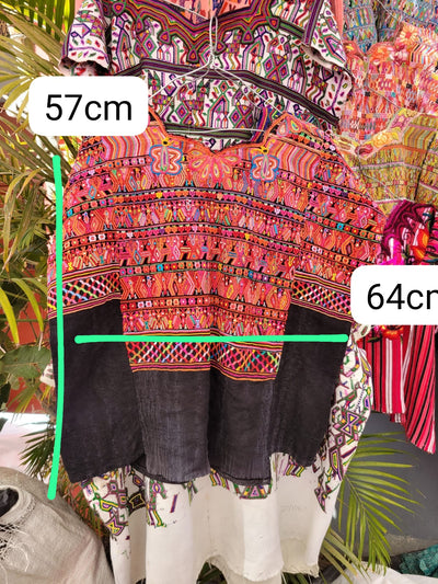 Pink and black San Juan Cotzal huipil for April