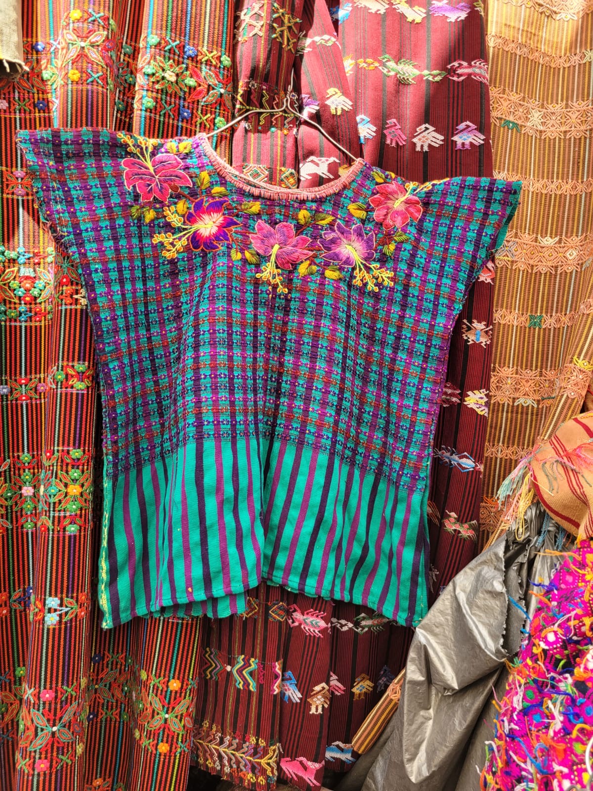 Turquoise and pink Santiago huipil for Tara