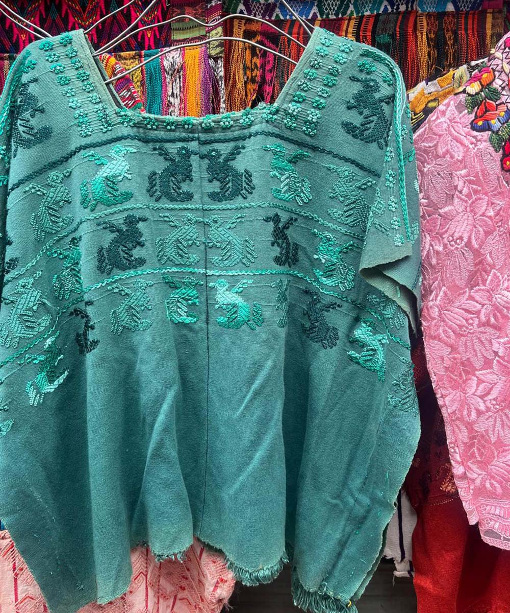Turquoise Toliman huipil with Quetzales