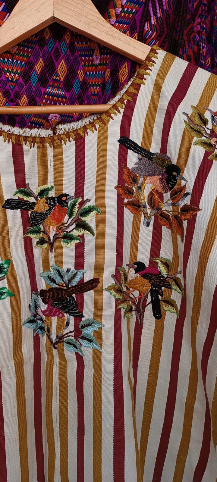 Brown and mustard striped Santiago huipil with birds