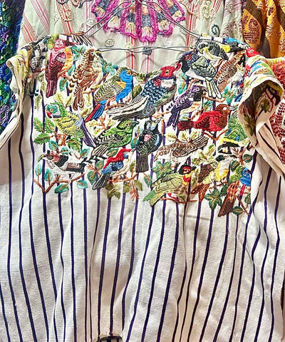 Striped Santiago huipil with large colorful birds