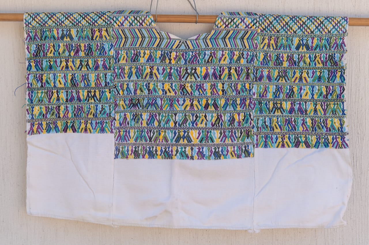 Blue and white San Juan Cotzal huipil for April