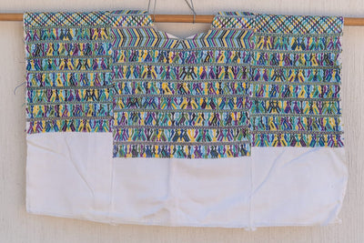 Blue and white San Juan Cotzal huipil for April