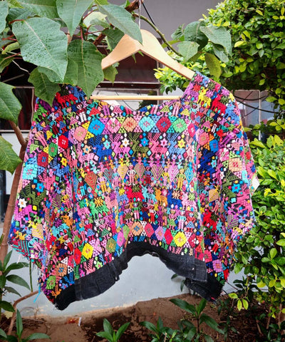 Colorful Coban huipil on black