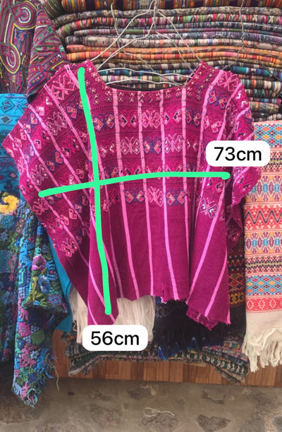 1 huipil rosado de San Lucas Tolimán y 1 huipil rojo de Colotenango (reservado para Janelle)