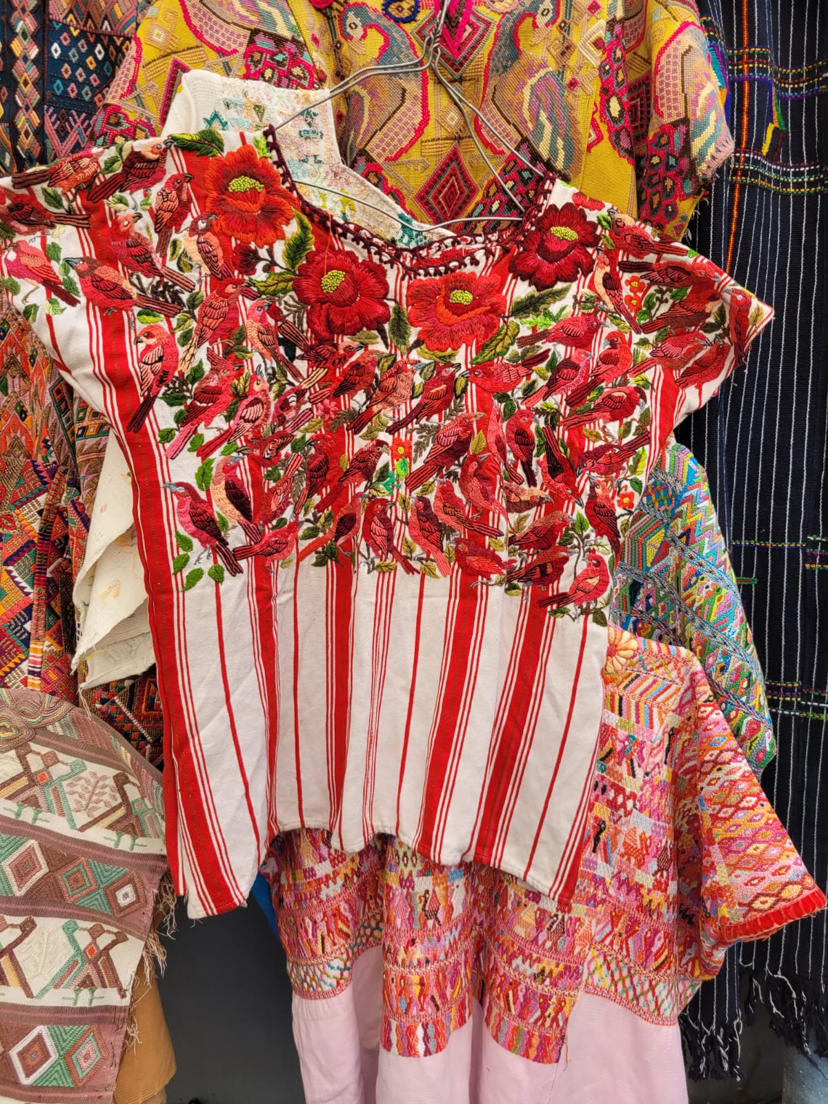 Extravagant red Santiago huipil for Myriam