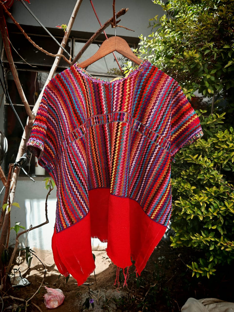 Red zigzag huipil for April