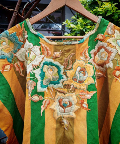 Green and gold Santiago floral huipil