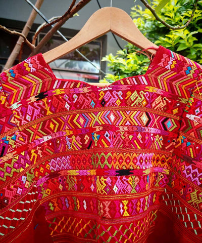 Bright red San Juan Cotzal huipil