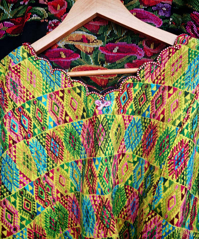 Colorful on yellow Coban huipil