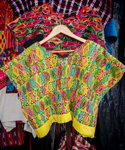 Colorful on yellow Coban huipil