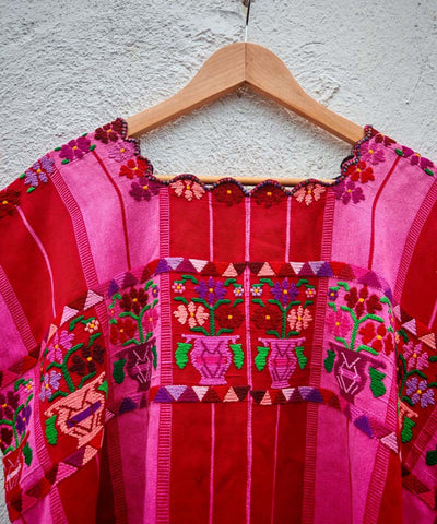 Hot pink and red floral huipil