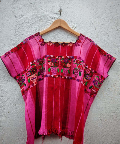 Hot pink and red floral huipil