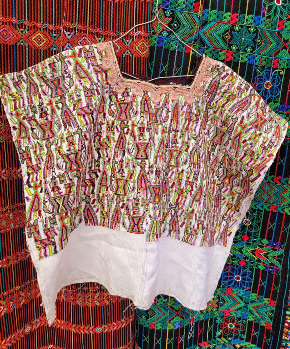 Traditional Nebaj huipil on white