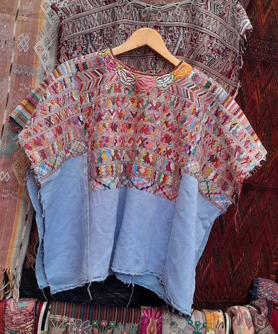Blue and pink San Juan Cotzal huipil
