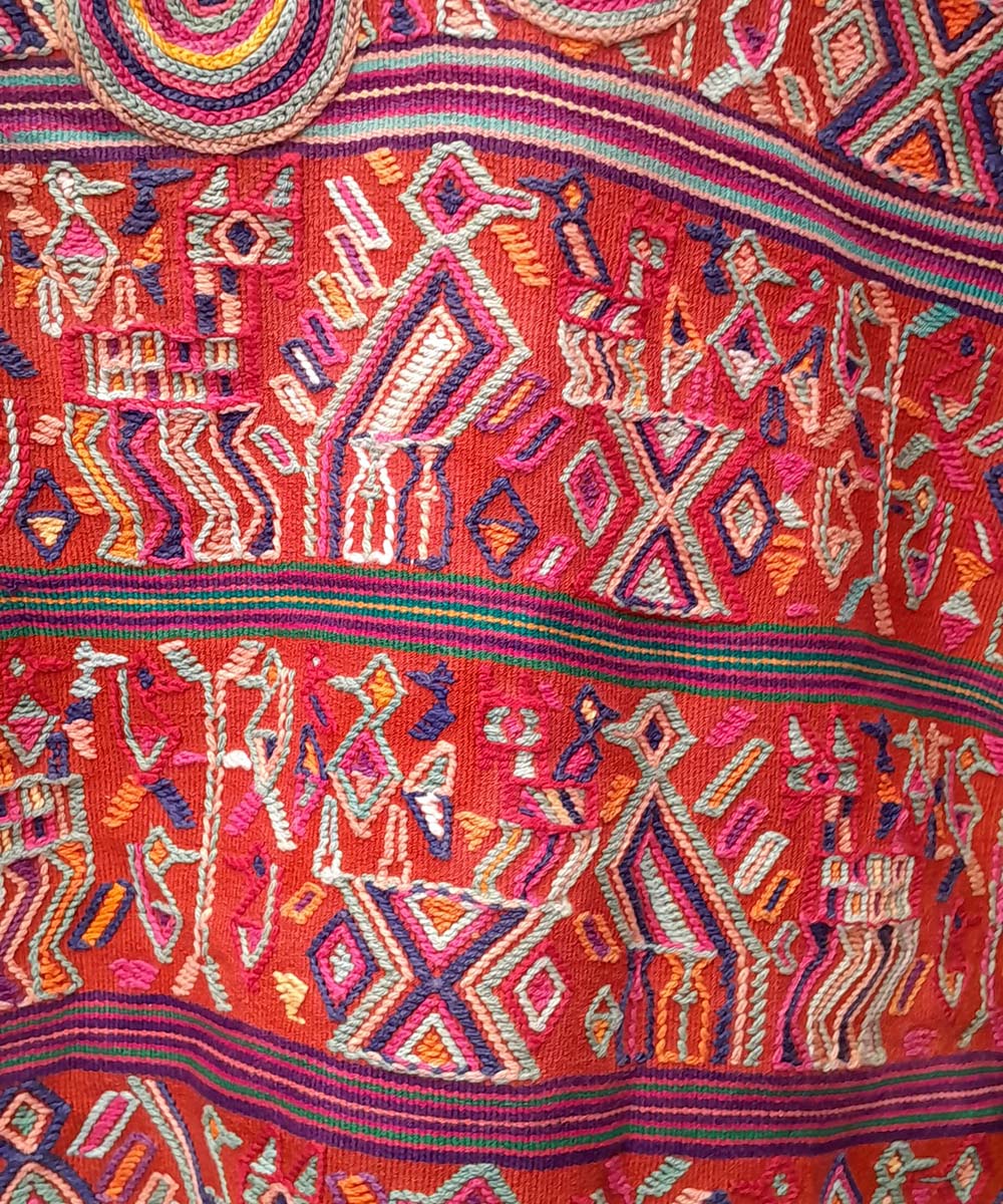 Bright red and white Nebaj huipil