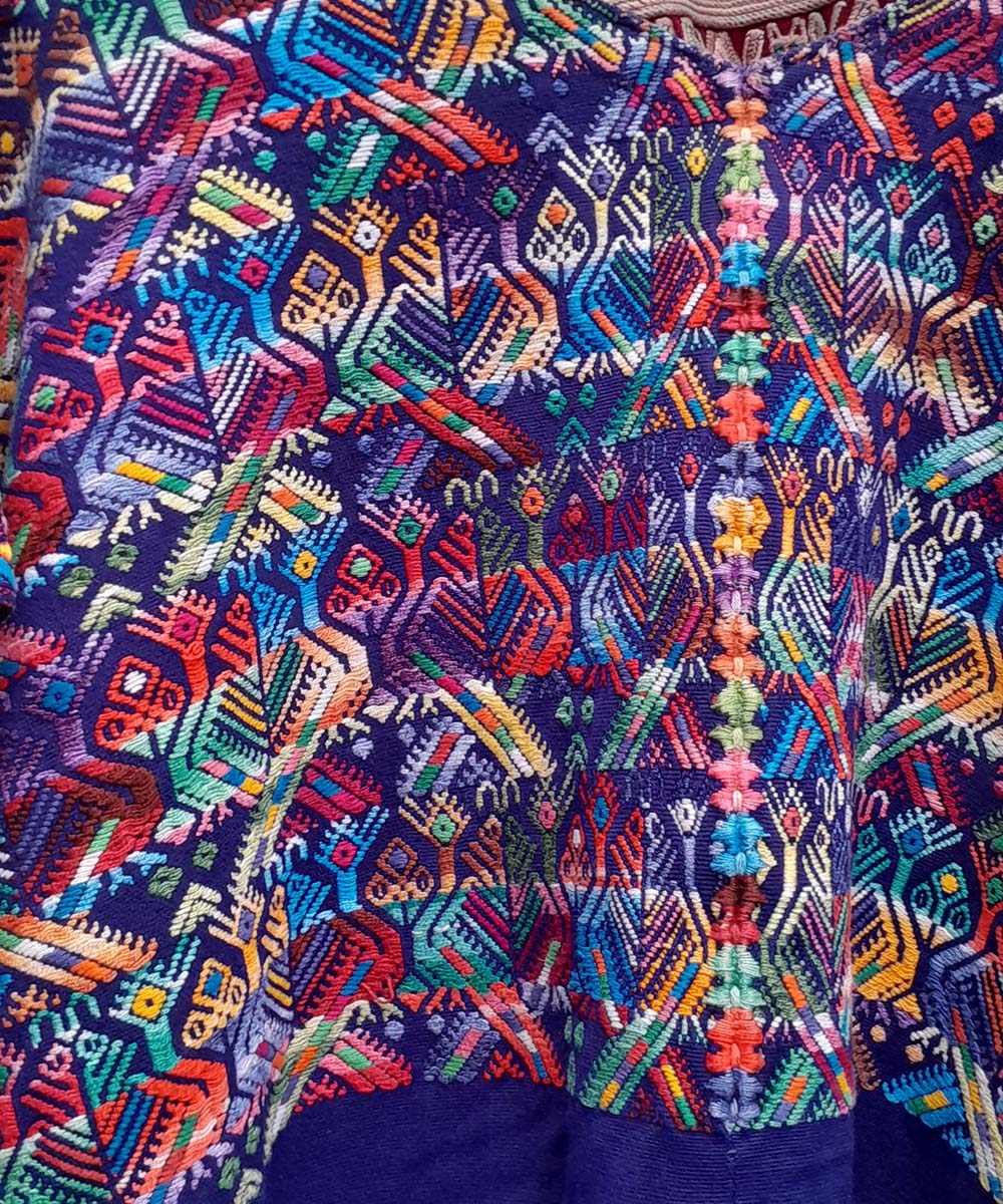 Bright blue Nahuala huipil with small quetzales