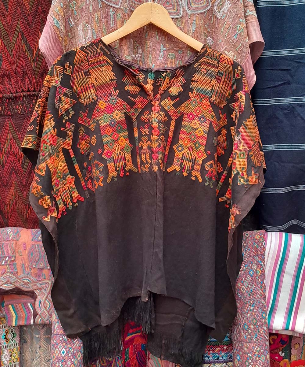 Nahuala huipil with dancing Mayan men