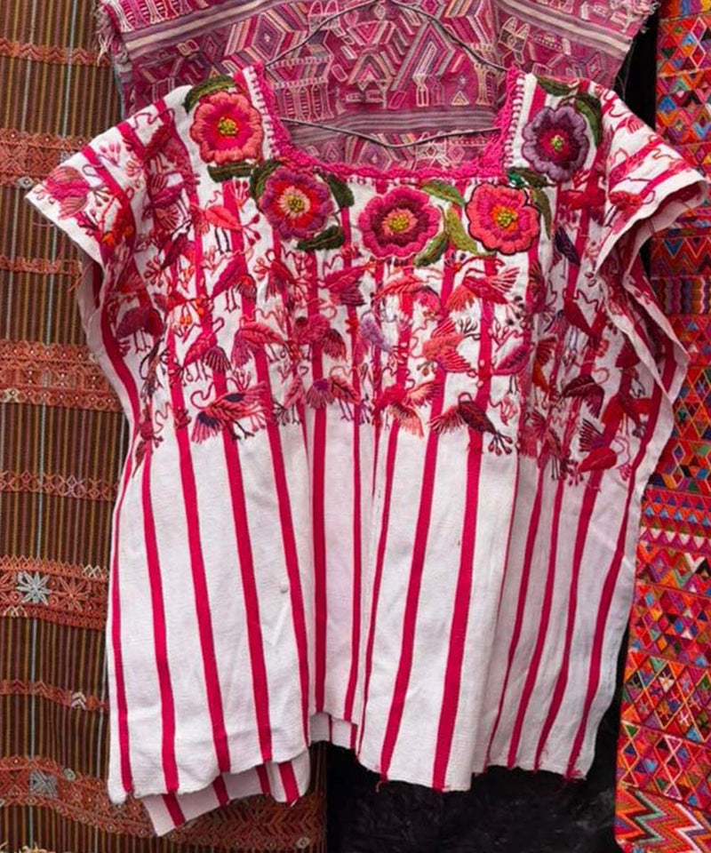 Red and white Santiago huipil with birds and flowers