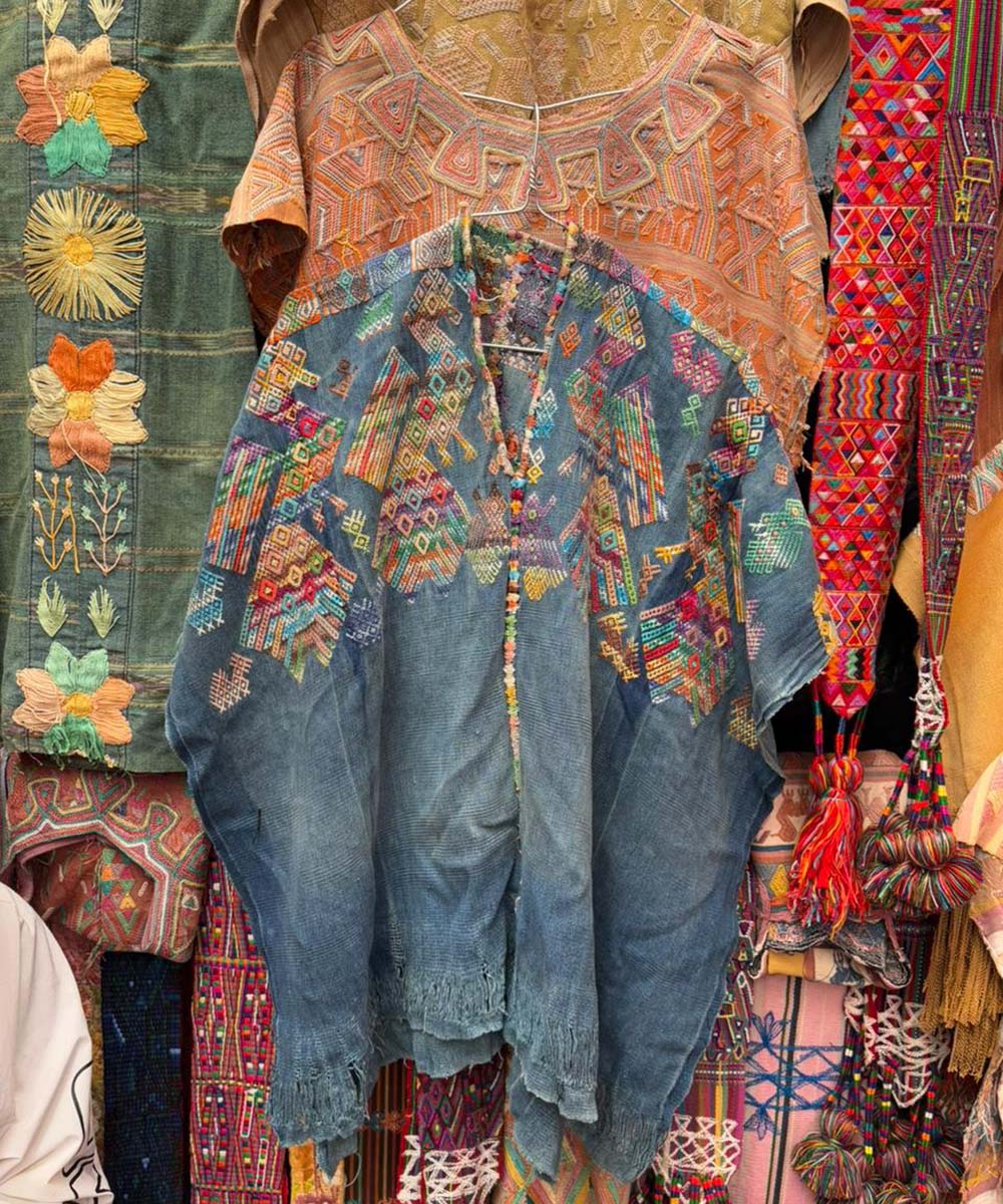 Indigo Nahuala huipil with colorful peacocks