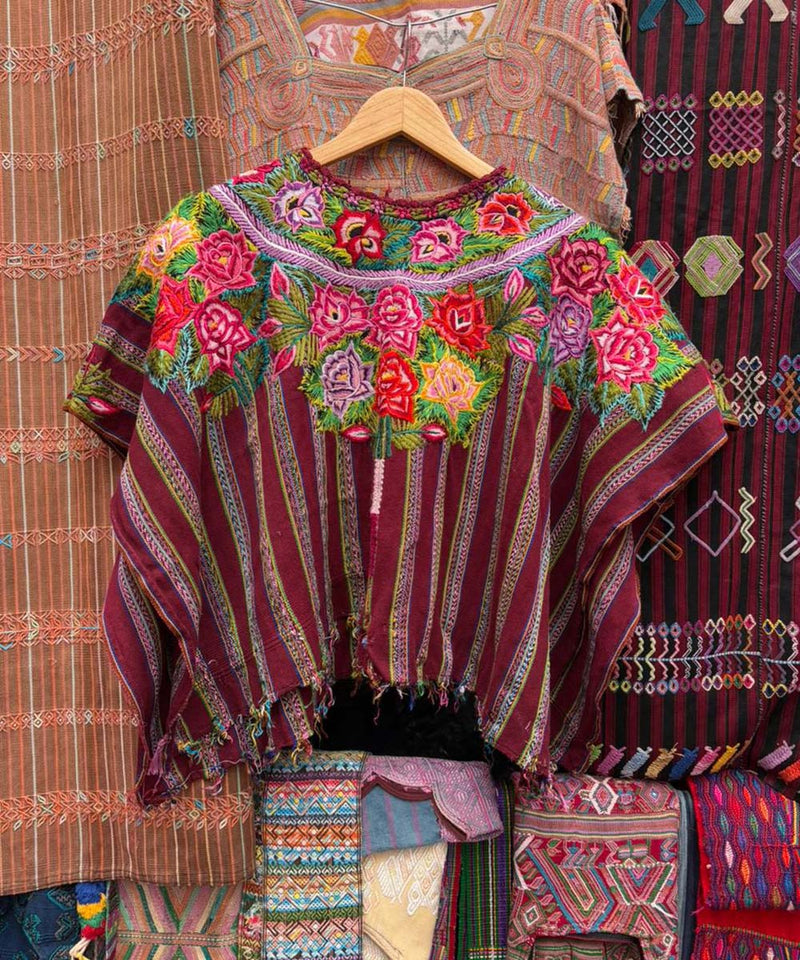 Floral Patzun huipil on burgundy