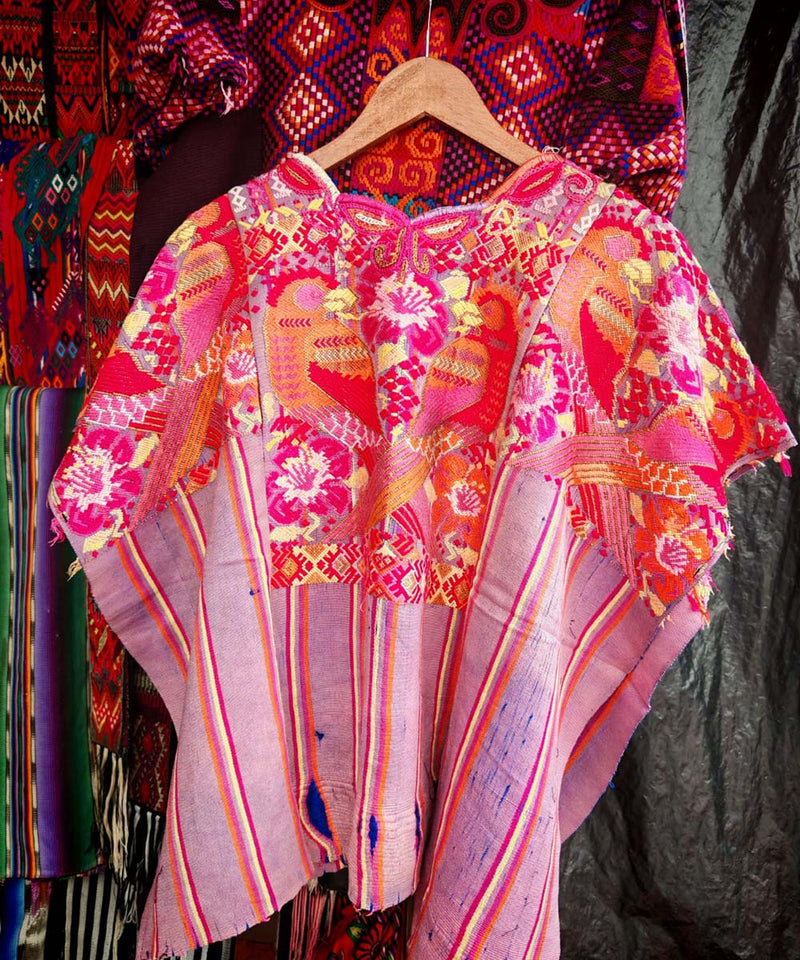 Mauve and orange Chichi huipil with parrots
