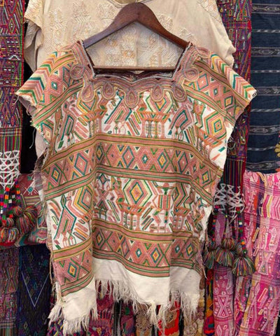 Warm pink and white Nebaj huipil