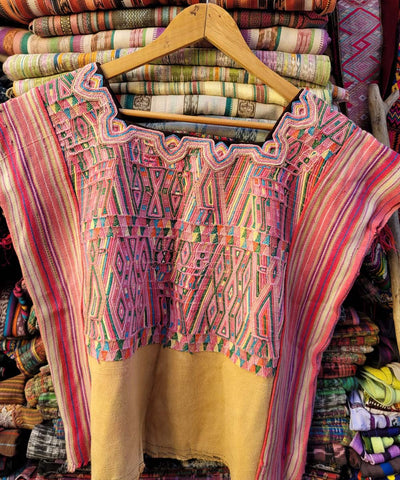 Pink and yellow Nebaj huipil