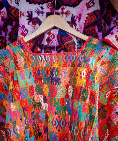 Colorful on orange Coban huipil