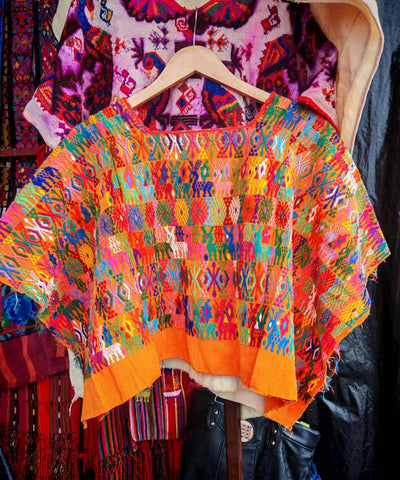 Colorful on orange Coban huipil