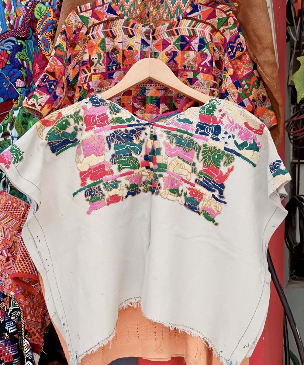 Guatemalan huipil with colourful Mayan figures