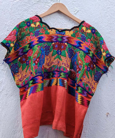 Colorful on orange Aguas Calientas huipil