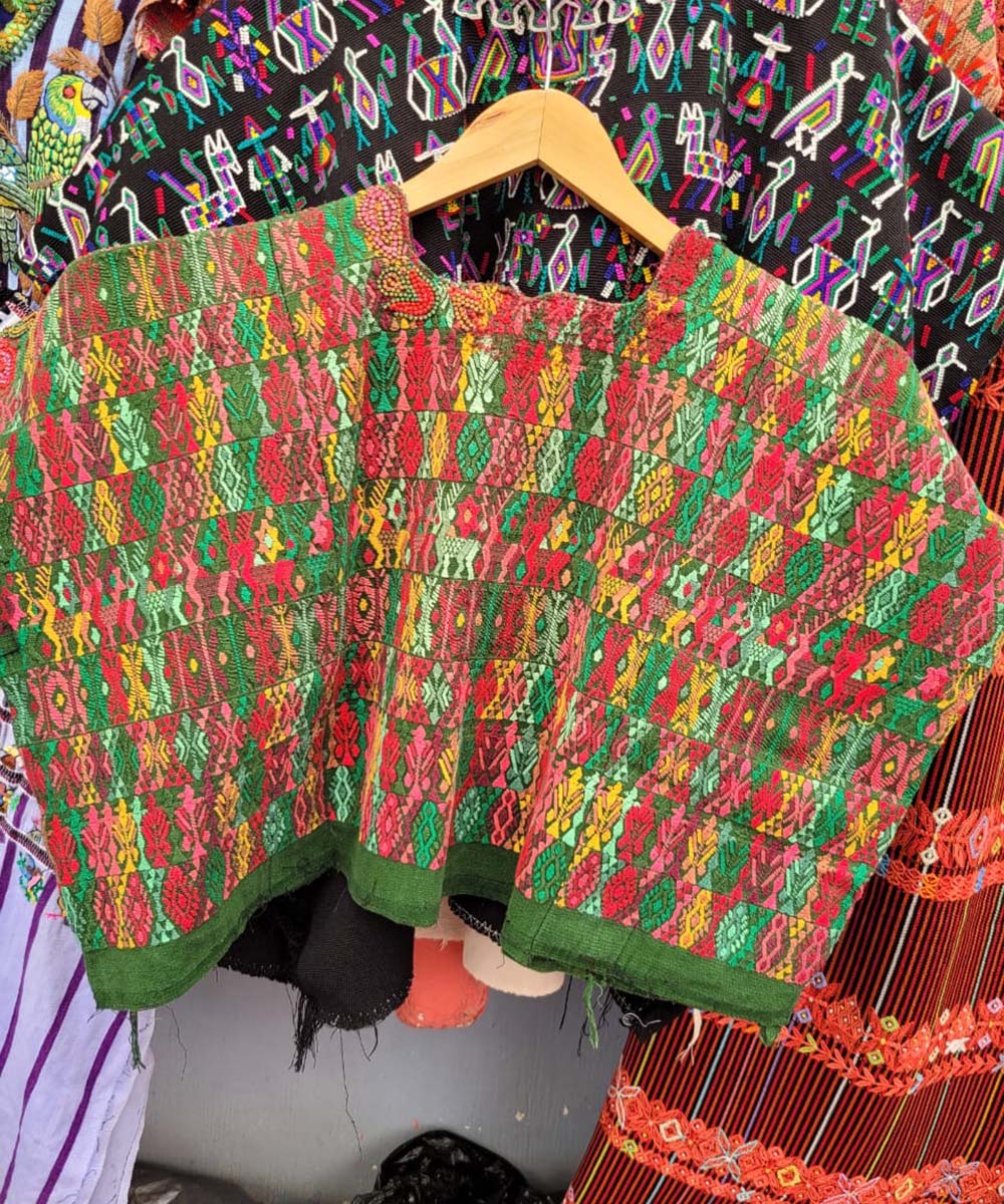 Colorful on green Coban huipil