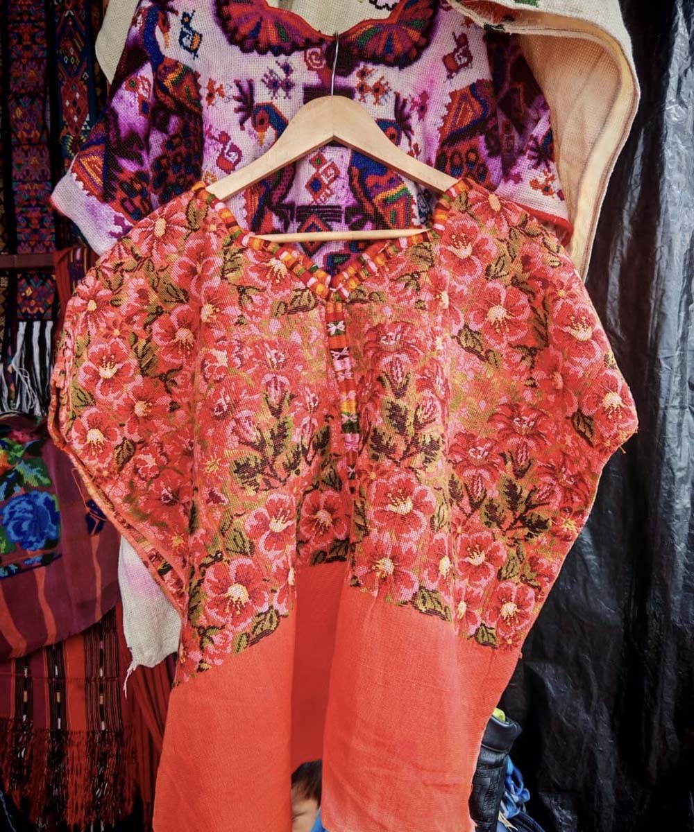 Bright orange floral Chichi huipil