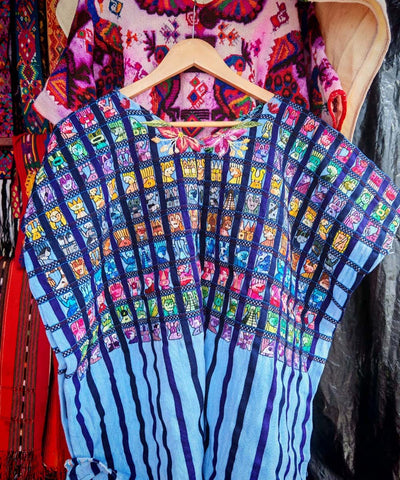 Blue Santiago huipil with Mayan figures