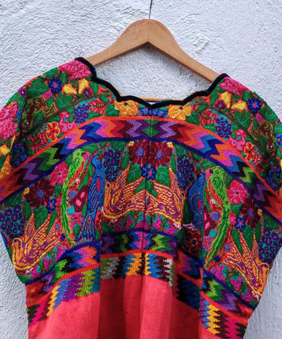 Colorful on orange Aguas Calientas huipil