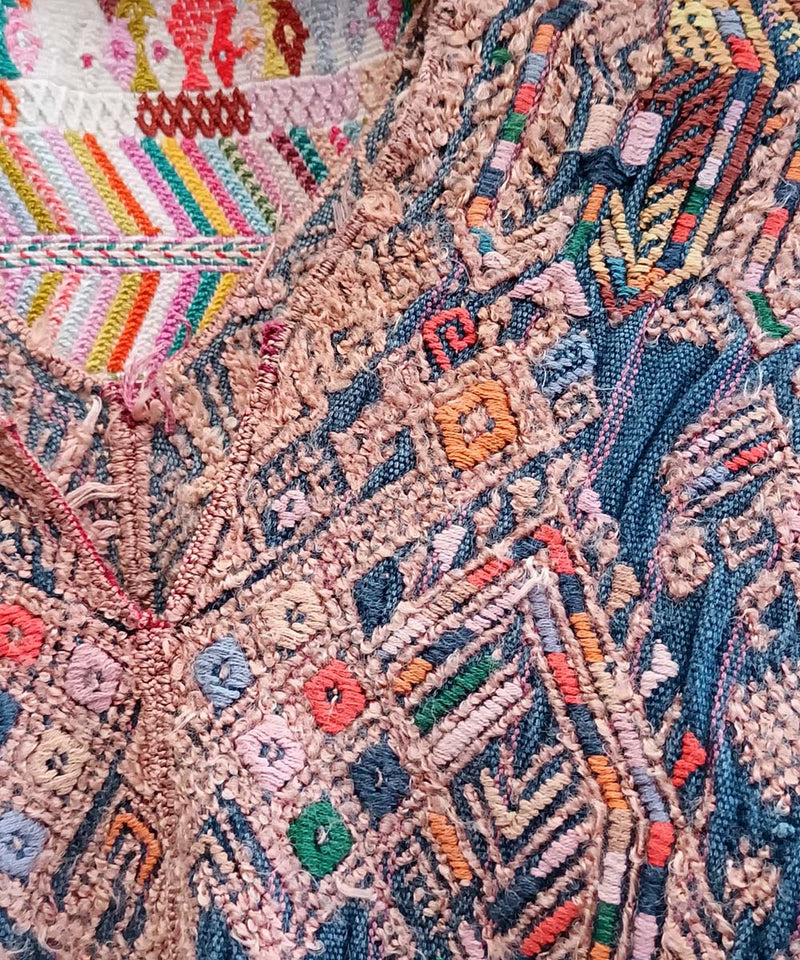 Indigo Nahuala huipil with stylised quetzales