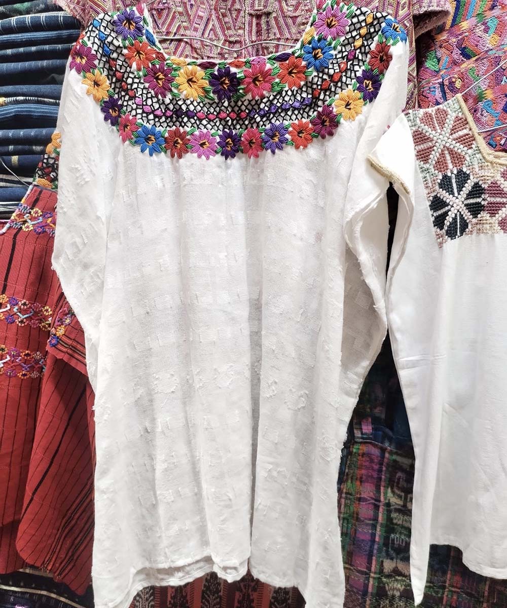 White Coban huipil with colorful neckline