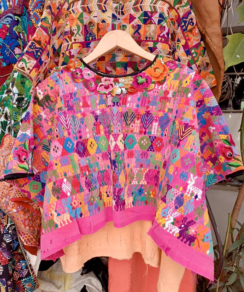 Colorful on pink Coban huipil