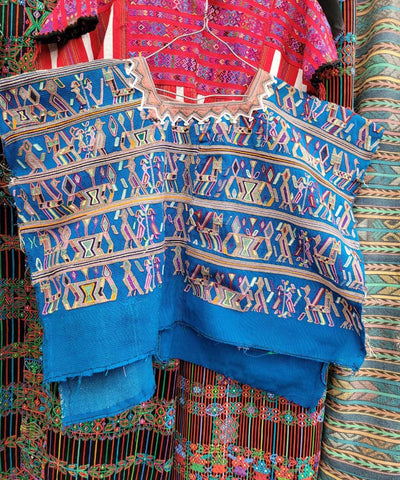 Bright blue Nebaj huipil with Mayan motifs
