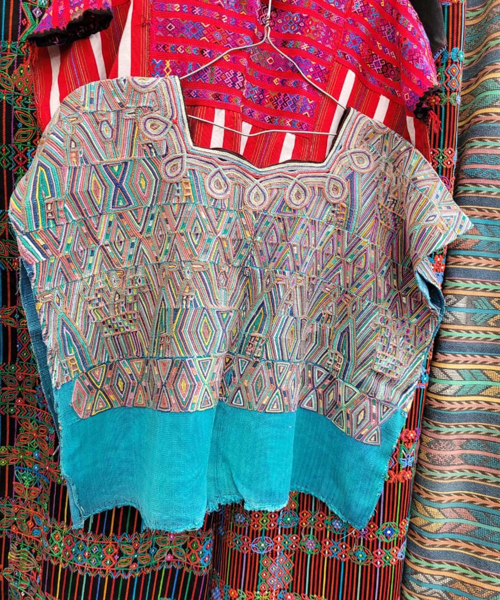 Colorful on sky blue Nebaj huipil