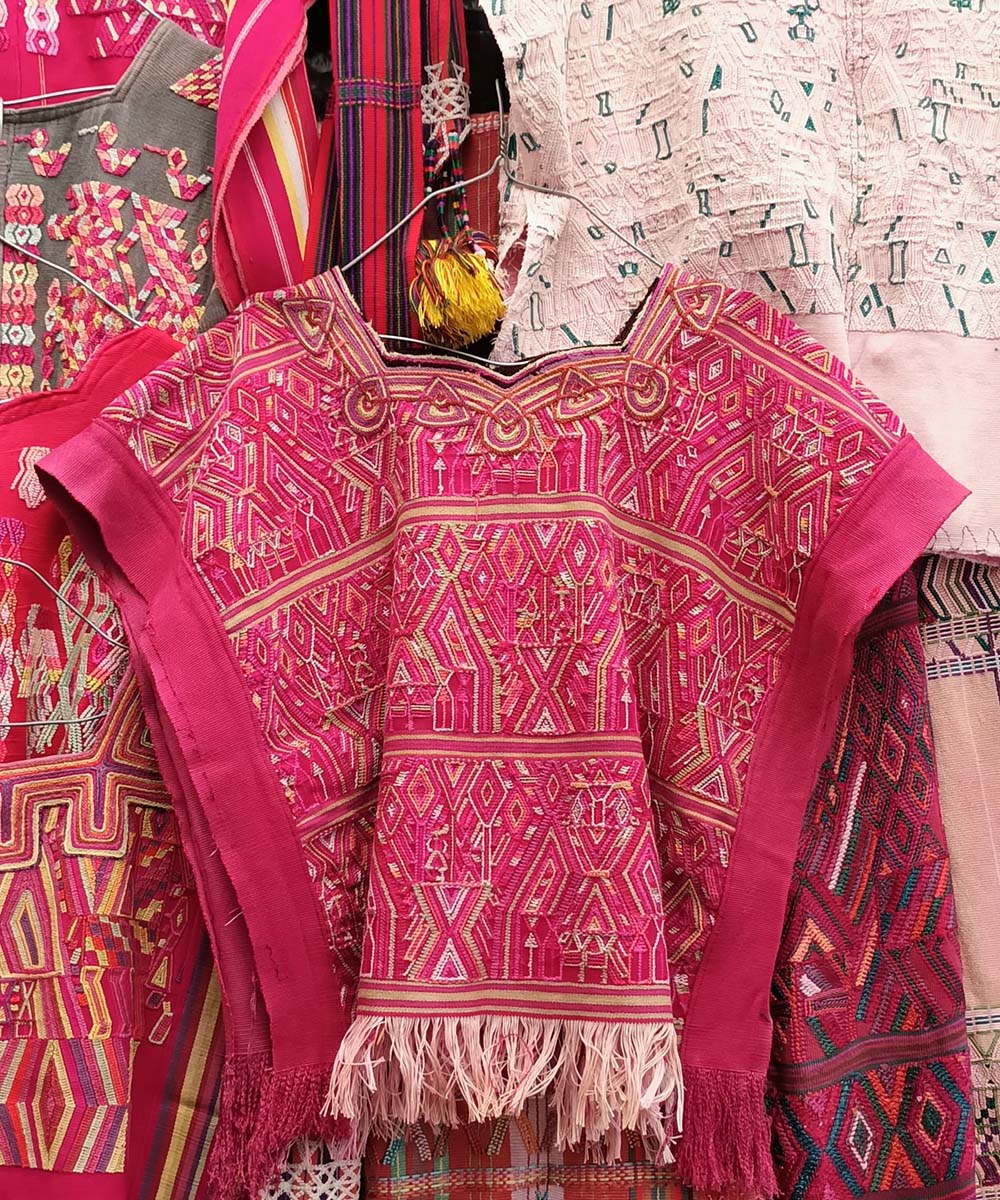 Bright red Nebaj huipil with fringe